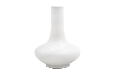 Lot 15 - A SMALL CHINESE WHITE-GLAZED 'DRAGON' BOTTLE VASE