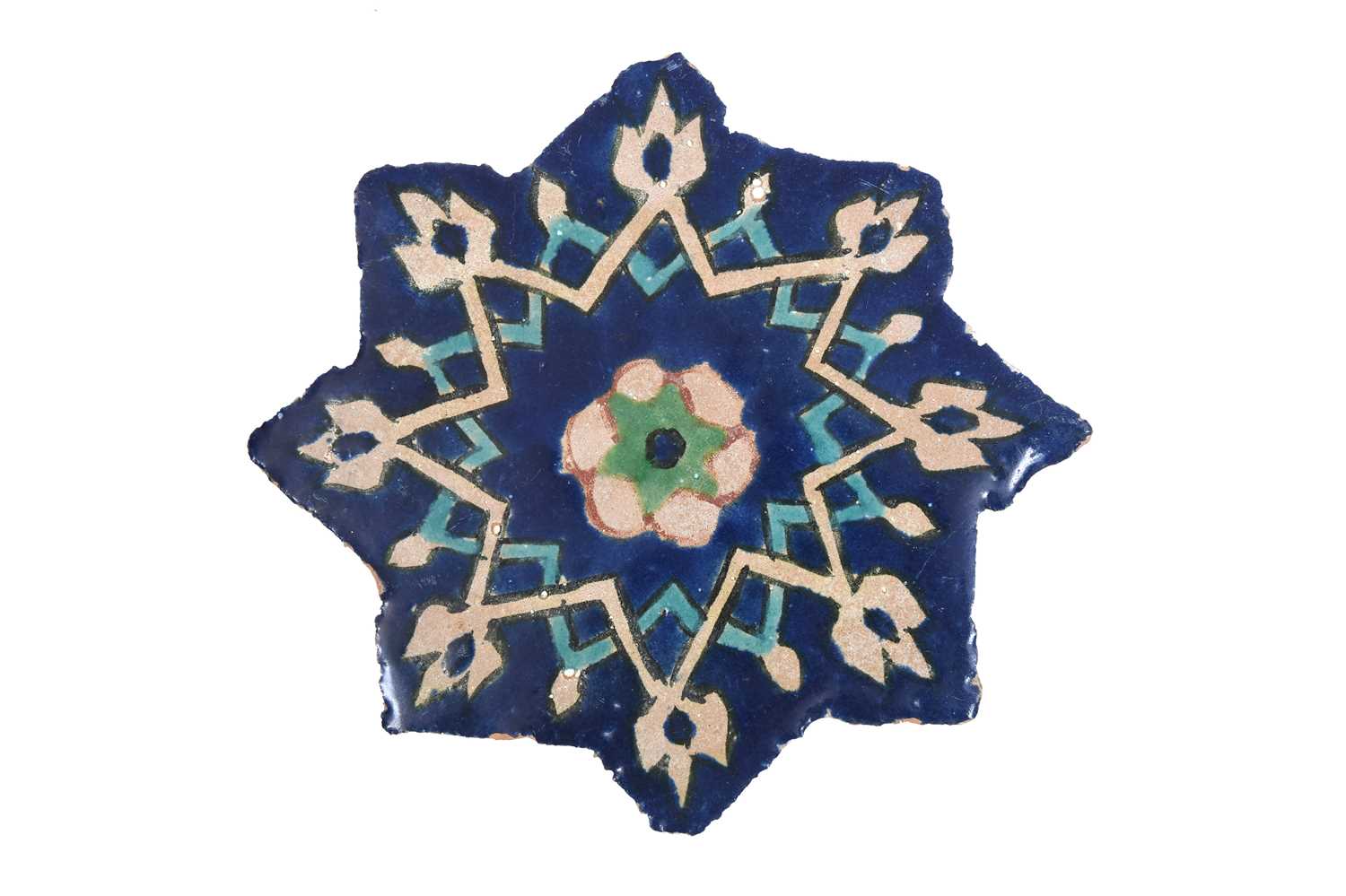 Lot 234 - A COBALT BLUE-PAINTED TIMURID-REVIVAL STAR-SHAPED POTTERY TILE