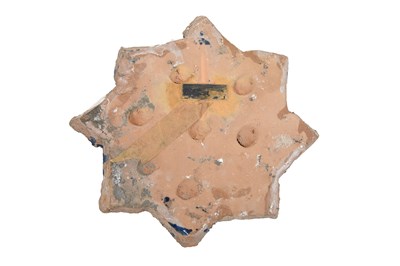 Lot 234 - A COBALT BLUE-PAINTED TIMURID-REVIVAL STAR-SHAPED POTTERY TILE