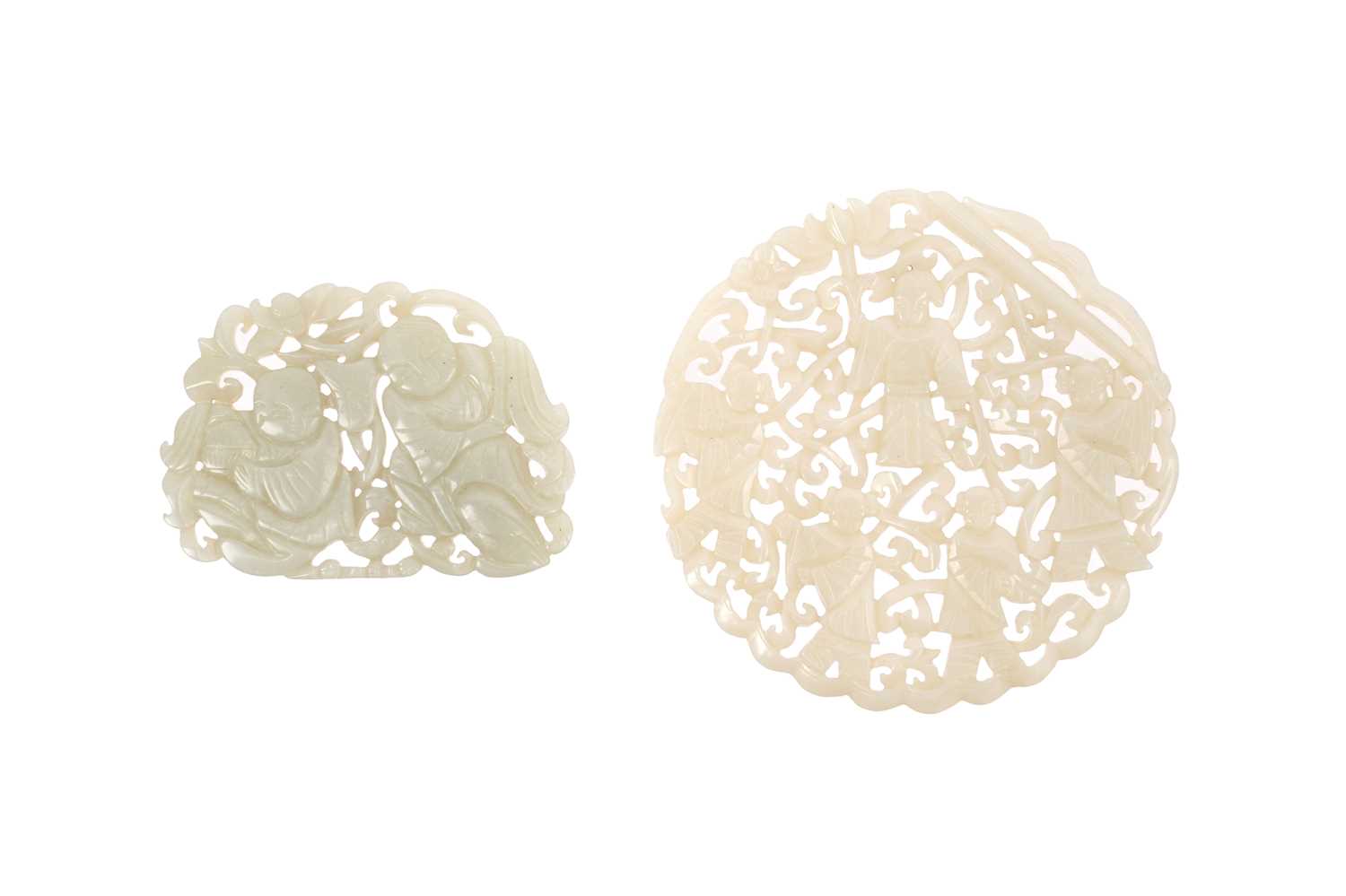 Lot 4 - TWO CHINESE PALE CELADON JADE RETICULATED 'BOYS' PLAQUES