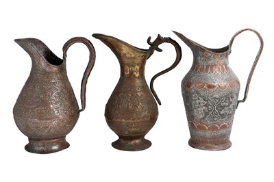 Lot 66 - A GROUP OF THREE TINNED COPPER PERSIAN EWERS