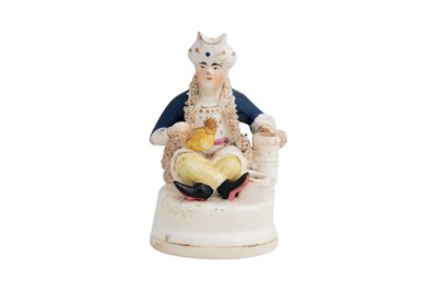 Lot 32 - AN ENGLISH STAFFORDSHIRE POTTERY FIGURE DEPICTING AN OTTOMAN DIGNITARY