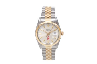 A RARE AND COLLECTABLE MEN’S STAINLESS STEEL AND 18K YELLOW GOLD AUTOMATIC BRACELET WATCH.