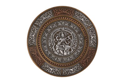 Lot 81 - A THANJAVUR BRASS DISH WITH SARASWATI