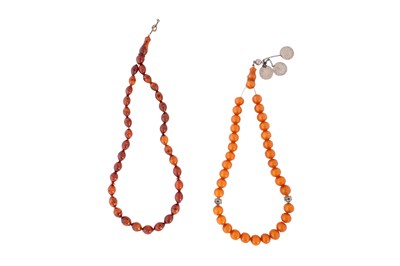 Lot 154 - A PAIR OF PRESSED AMBER-STYLE PRAYER BEADS (TASBIH)