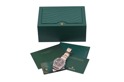 A MEN'S ROLEX STAINLESS STEEL AND 18K ROSE GOLD AUTOMATIC BRACELET WATCH WITH A WIMBLEDON DIAL.