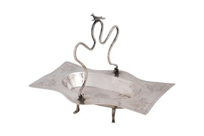Lot 185 - A SILVER FOUR-FOOTED TRAY WITH CURVED HANDLE