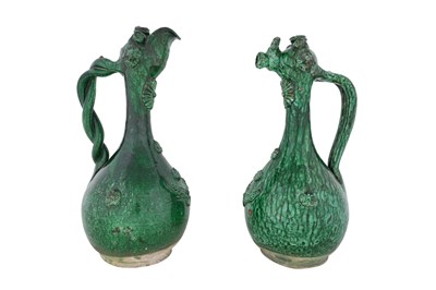 Lot 31 - A PAIR OF GREEN-GLAZED POTTERY ÇANAKKALE POTTERY EWERS