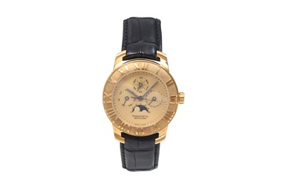 A TIFFANY & CO MEN’S 18K YELLWO GOLD AUTOMATIC TRIPLE CALENDAR AND MOON PHASE WRISTWATCH.