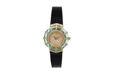 A CORUM LADIES 18K YELLOW GOLD, DIAMOND AND GREEN SYNTHETIC SAPPHIRE SET QUARTZ WRISTWATCH.