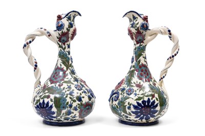 Lot 178 - A PAIR OF TURKISH ÇANAKKALE-STYLE POLYCHROME-PAINTED AND GILT ZSOLNAY POTTERY EWERS