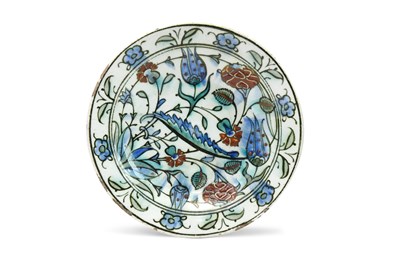 Lot 175 - A SMALL IZNIK POTTERY DISH WITH SAZ LEAF AND FLOWERS