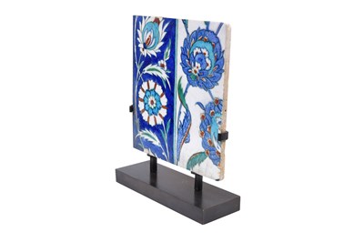 Lot 166 - AN IZNIK POTTERY TILE WITH LOTUS FLOWERS AND SAZ LEAVES