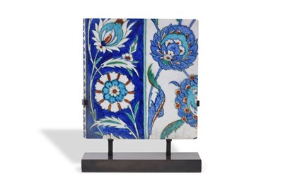 Lot 166 - AN IZNIK POTTERY TILE WITH LOTUS FLOWERS AND SAZ LEAVES