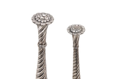 Lot 93 - A NEAR PAIR OF INDIAN PARCEL-GILT EMBOSSED SILVER ROSEWATER SPRINKLERS (GULABPASH)