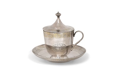 Lot 90 - AN INDIAN PARCEL-GILT SILVER TEA CUP AND SAUCER