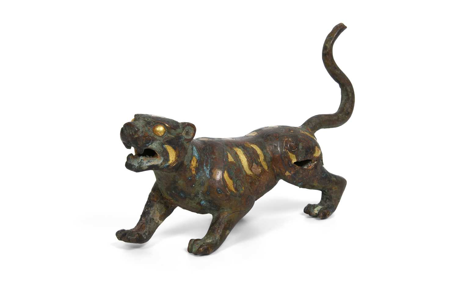 Lot 4 - A CHINESE PARCEL-GILT BRONZE FIGURE OF A TIGER