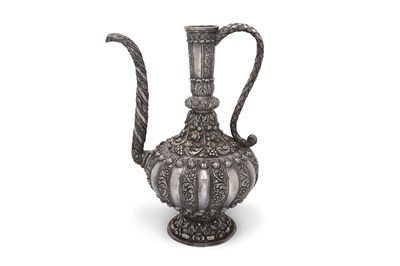 Lot 87 - AN UNMARKED INDIAN REPOUSSÉ SILVER EWER (AFTABA) WITH VEGETAL MOTIFS