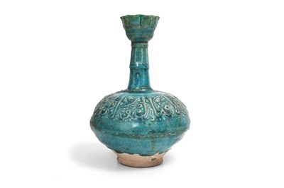 Lot 159 - A MONOCHROME TURQUOISE-GLAZED MOULDED KASHAN POTTERY VASE WITH CALLIGRAPHY