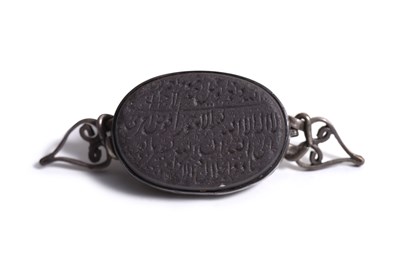 Lot 28 - A TALISMANIC BAZUBAND PENDANT WITH ARABIC PRAYERS AND INVOCATIONS