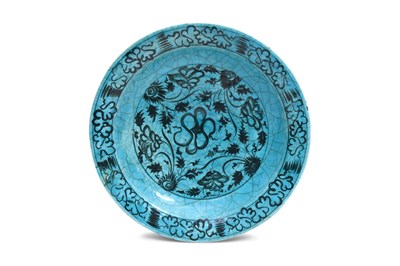 Lot 147 - A SAFAVID BLACK AND TURQUOISE KUBACHI POTTERY DISH WITH FLOWER SCROLLS