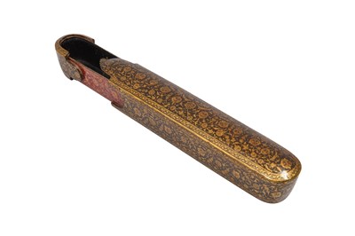 Lot 137 - A QAJAR LACQUERED PAPIER-MÂCHÉ PEN CASE (QALAMDAN) WITH LOTUS SCROLLS