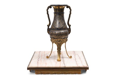 Lot 227 - AN HISPANO-MORESQUE REVIVAL GOLD AND SILVER-DAMASCENED FORGED IRON VASE ON A MARBLE STAND