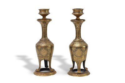 Lot 85 - A PAIR OF GOLD-DAMASCENED (KOFTGARI) STEEL CANDLESTICKS