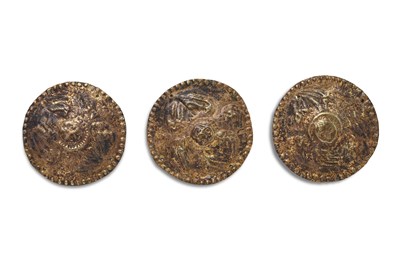 Lot 192 - THREE GILT COPPER REPOUSSÉ DECORATIVE ROUNDELS WITH WINGED CHERUBS