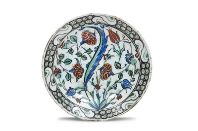 Lot 176 - AN IZNIK POTTERY DISH WITH CARNATIONS, TULIPS AND HYACINTHS