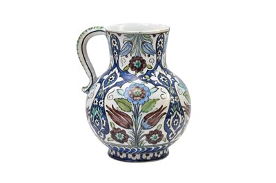 Lot 177 - AN OTTOMAN DAMASCUS-STYLE CANTAGALLI POTTERY JUG WITH TULIPS AND ROSES