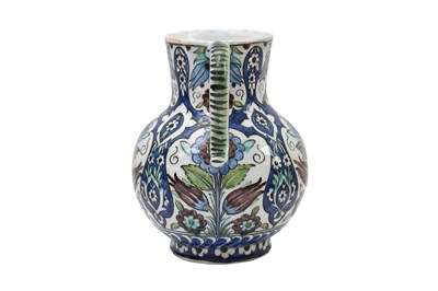 Lot 177 - AN OTTOMAN DAMASCUS-STYLE CANTAGALLI POTTERY JUG WITH TULIPS AND ROSES