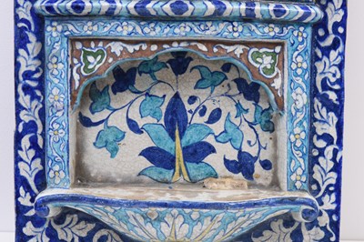 Lot 345 - A LARGE POLYCHROME-PAINTED ARCHITECTURAL MULTAN POTTERY TILE WITH CHHAJJA MOTIF