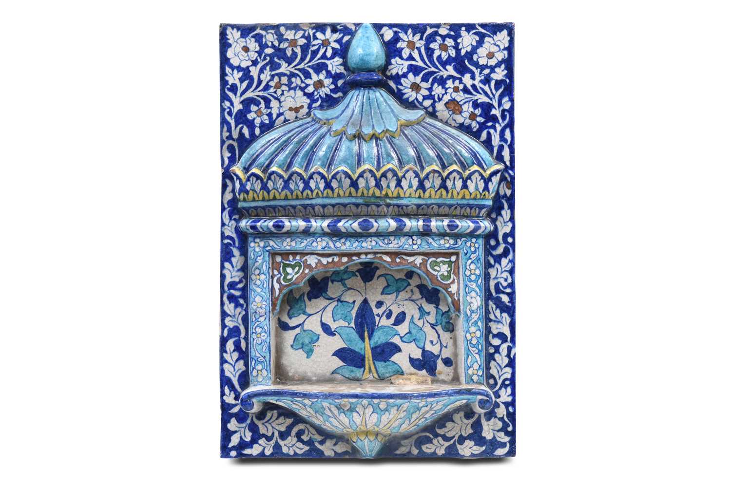 Lot 345 - A LARGE POLYCHROME-PAINTED ARCHITECTURAL MULTAN POTTERY TILE WITH CHHAJJA MOTIF