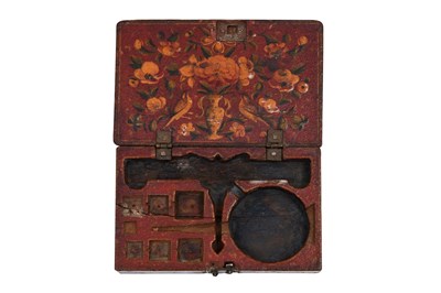 Lot 134 - A MINIATURE QAJAR LACQUERED PAPIER-MÂCHÉ WEIGHING TOOLBOX