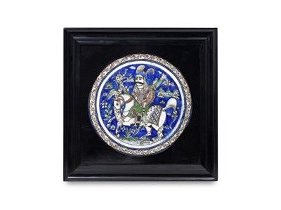 Lot 156 - A QAJAR POLYCHROME-PAINTED CIRCULAR POTTERY TILE WITH RIDER AND DRAGON