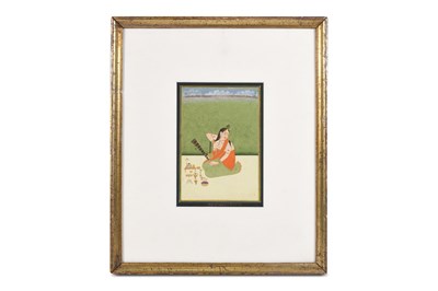 Lot 43 - A VAISHNAVITE FEMALE DEVOTEE OR PRIESTESS OFFICIATING A PUJA