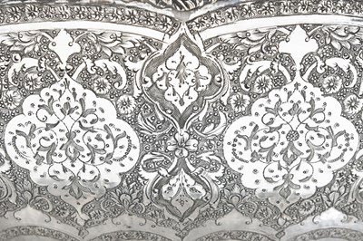 Lot 109 - A LARGE ENGRAVED IRANIAN SILVER BOWL AND TRAY BY MAHMUD RABI'I