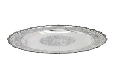 Lot 109 - A LARGE ENGRAVED IRANIAN SILVER BOWL AND TRAY BY MAHMUD RABI'I