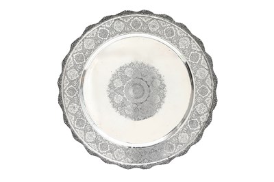 Lot 109 - A LARGE ENGRAVED IRANIAN SILVER BOWL AND TRAY BY MAHMUD RABI'I