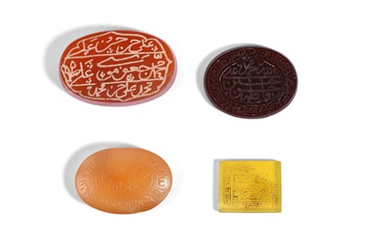 Lot 30 - FOUR ENGRAVED AND ETCHED SHI'A HARDSTONE AMULETS