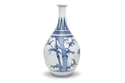 Lot 73 - A LARGE BLUE AND WHITE ARITA 'PRUNUS AND BAMBOO' BOTTLE VASE