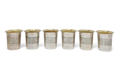 Lot 185 - A SET OF SIX OTTOMAN PARCEL-GILT SILVER DRINKING CUPS