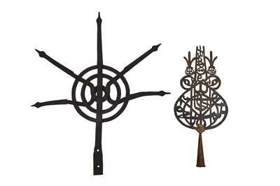 Lot 90 - A PIERCED COPPER SHI'A 'ALAM (STANDARD) AND A HINDU STEEL FINIAL WITH SPIKES