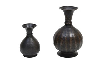 Lot 10 - TWO CAST INDIAN BOTTLES WITH FLUTED NECKS